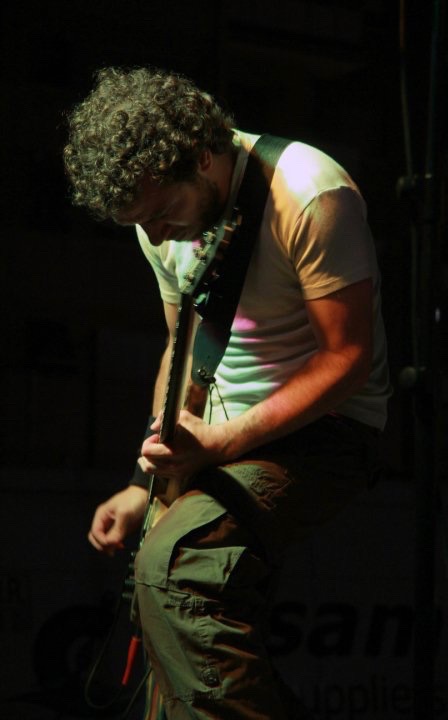 Alex Fisherman playing guitar